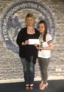 Jade Barsby presenting Tracy Smith with her vouchers and trophy